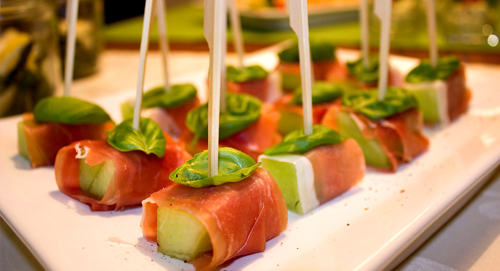 Muskmelon wrapped in prosciutto dish